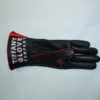 A black and red glove is on the ground