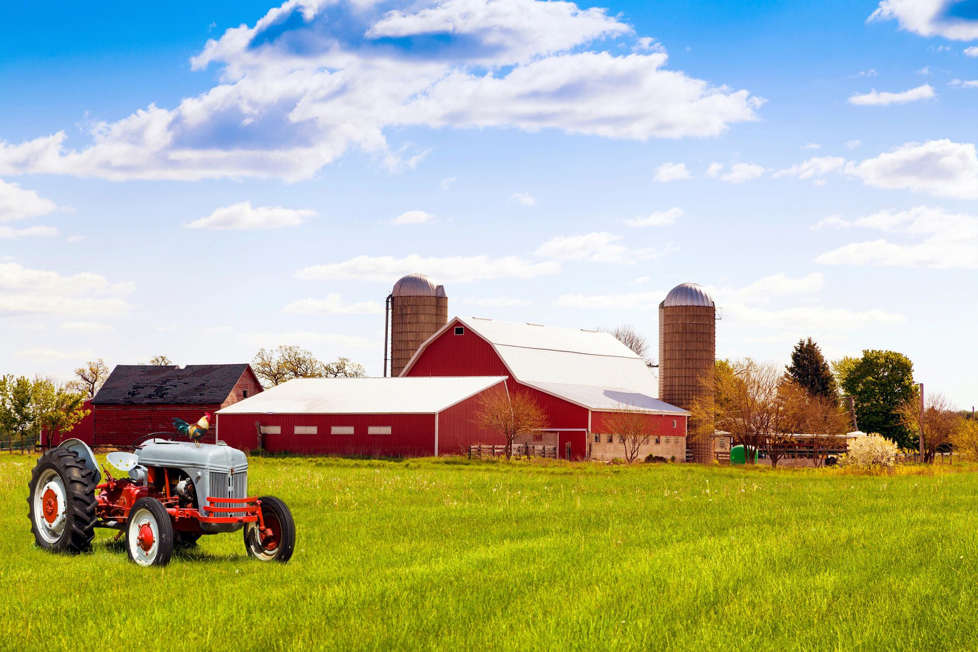 A tractor in the middle of an open field.